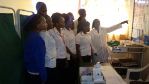 Ruth Mbugua, Head of Department Community Health Nursing showing students how to interprete the results of cervical cancer screening at Igegania Subcounty Hospital.
